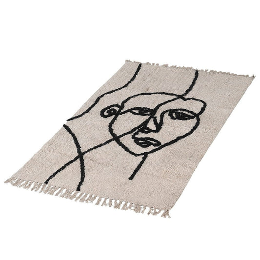 Abstract face cotton rug