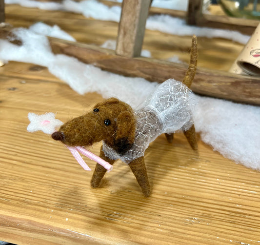 Tutu wearing woolen sausage dog